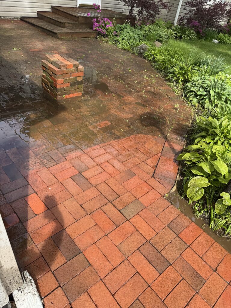 Wiley's Pressure Washing Services shows a brick paver before being cleaned by Wiley's Pressure Washing Services in Kirtland, OH