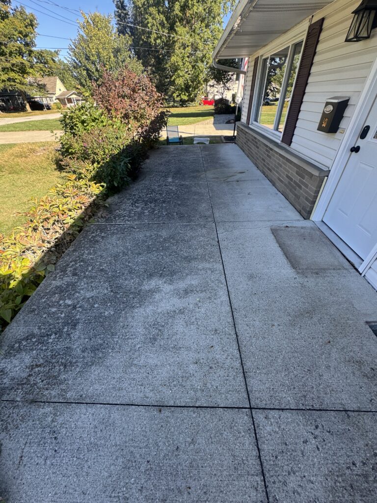 Dirty concrete porch before pressure washing in Mentor-on-the-Lake OH