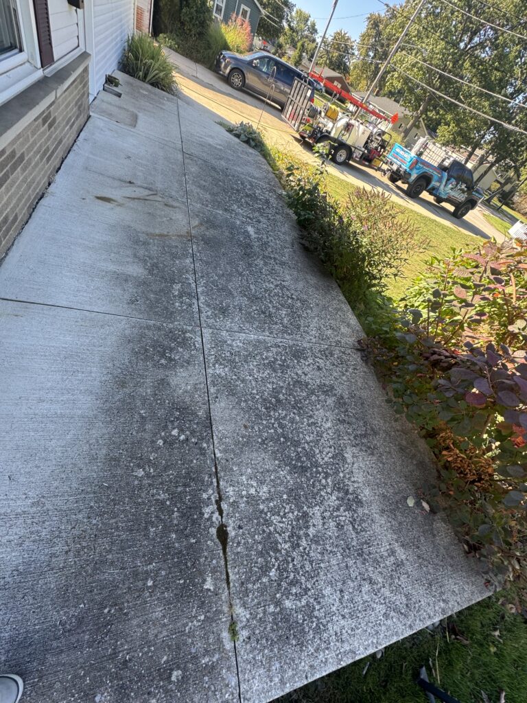 Dirty concrete driveway before pressure washing in Mentor-on-the-Lake OH
