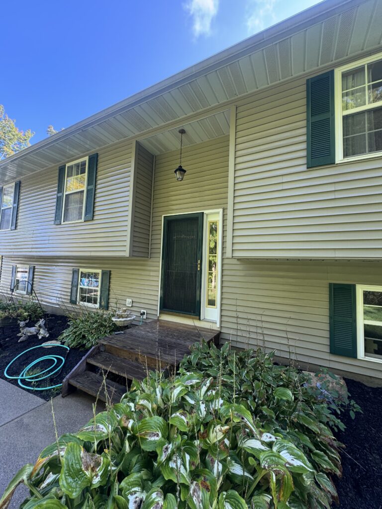 Clean vinyl siding after soft house washing by Wiley's Pressure Washing Service in Thompson OH.