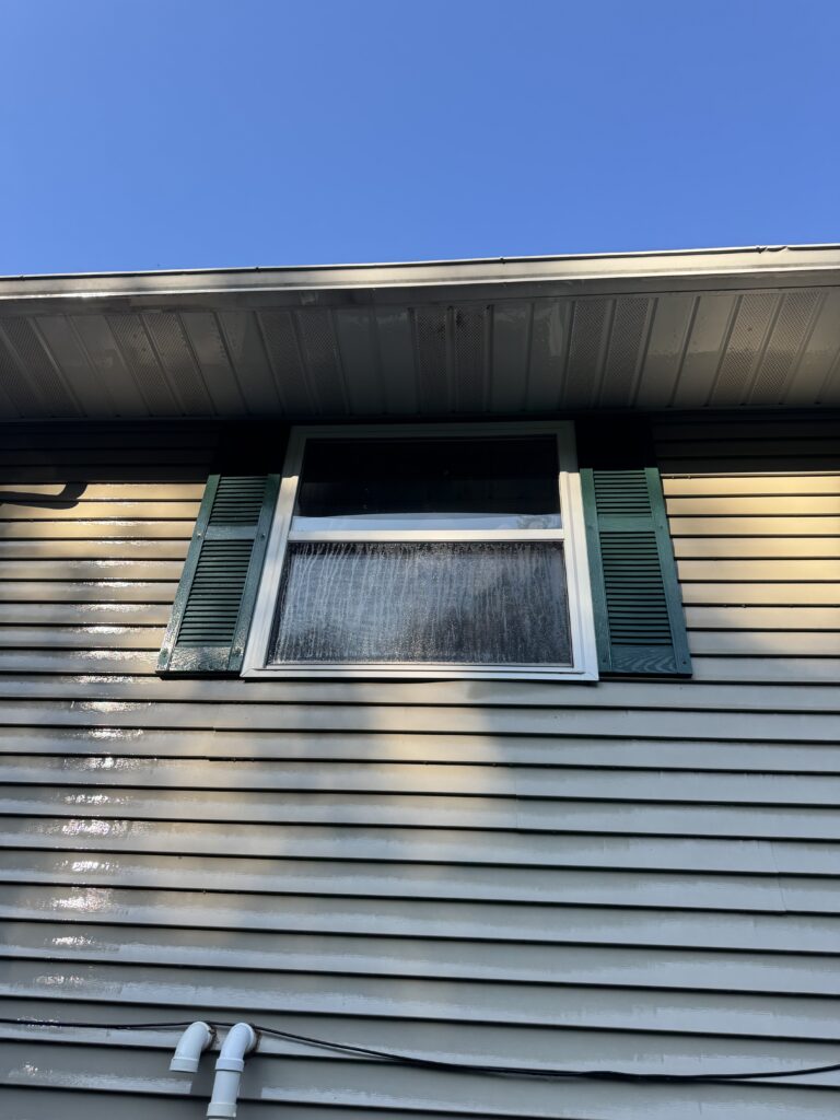 Clean vinyl siding after soft house washing by Wiley's Pressure Washing Service in Thompson OH.