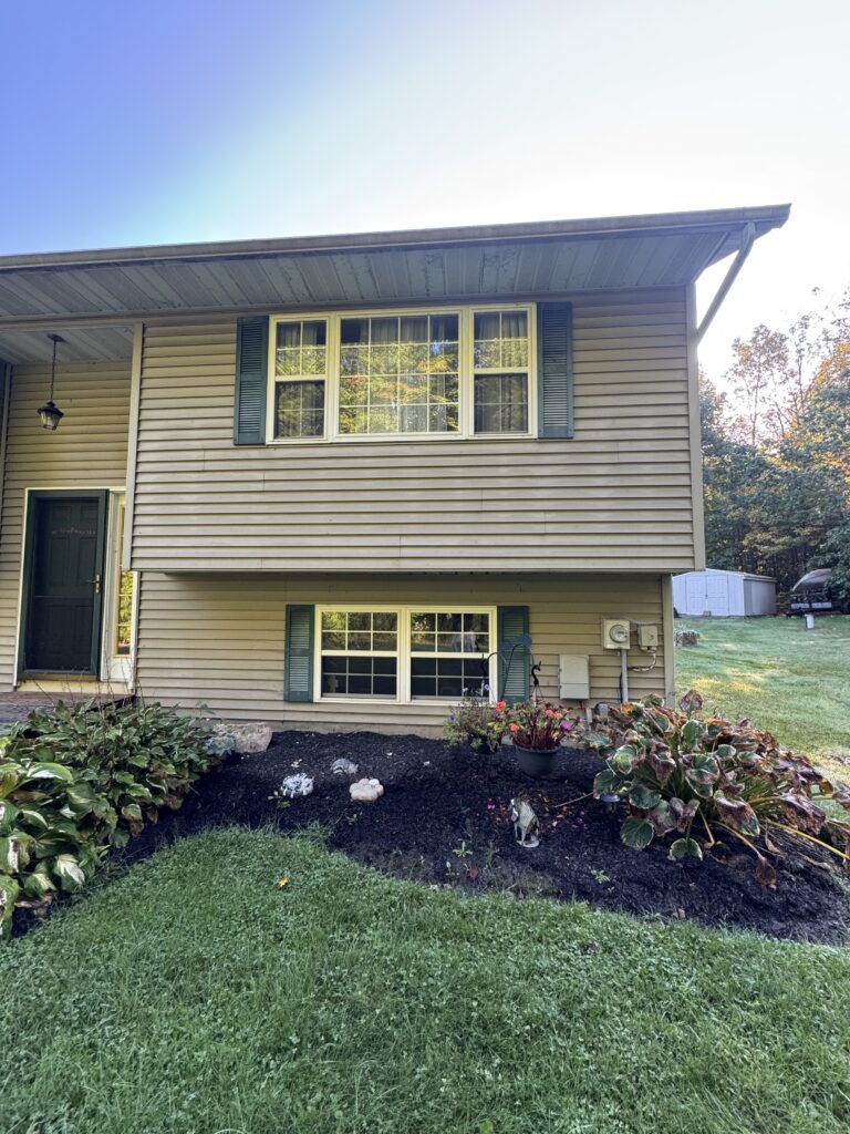 Clean vinyl siding after soft house washing by Wiley's Pressure Washing Service in Thompson OH.