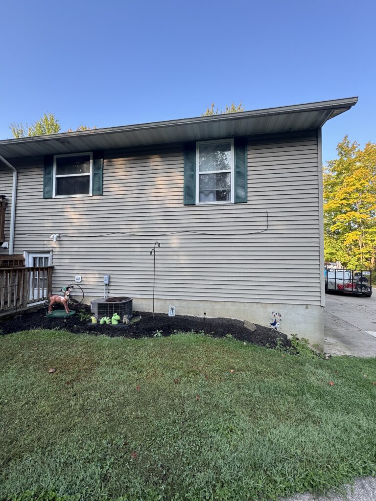 Clean vinyl siding after soft house washing by Wiley's Pressure Washing Service in Thompson OH.