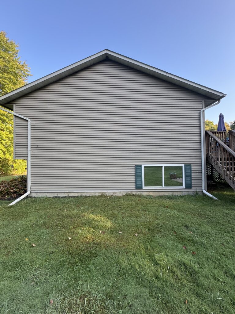 Clean vinyl siding after soft house washing by Wiley's Pressure Washing Service in Thompson OH.