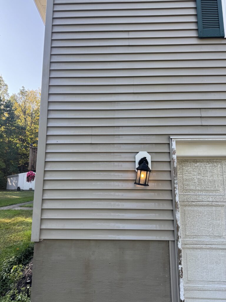 Clean vinyl siding after soft house washing by Wiley's Pressure Washing Service in Thompson OH.