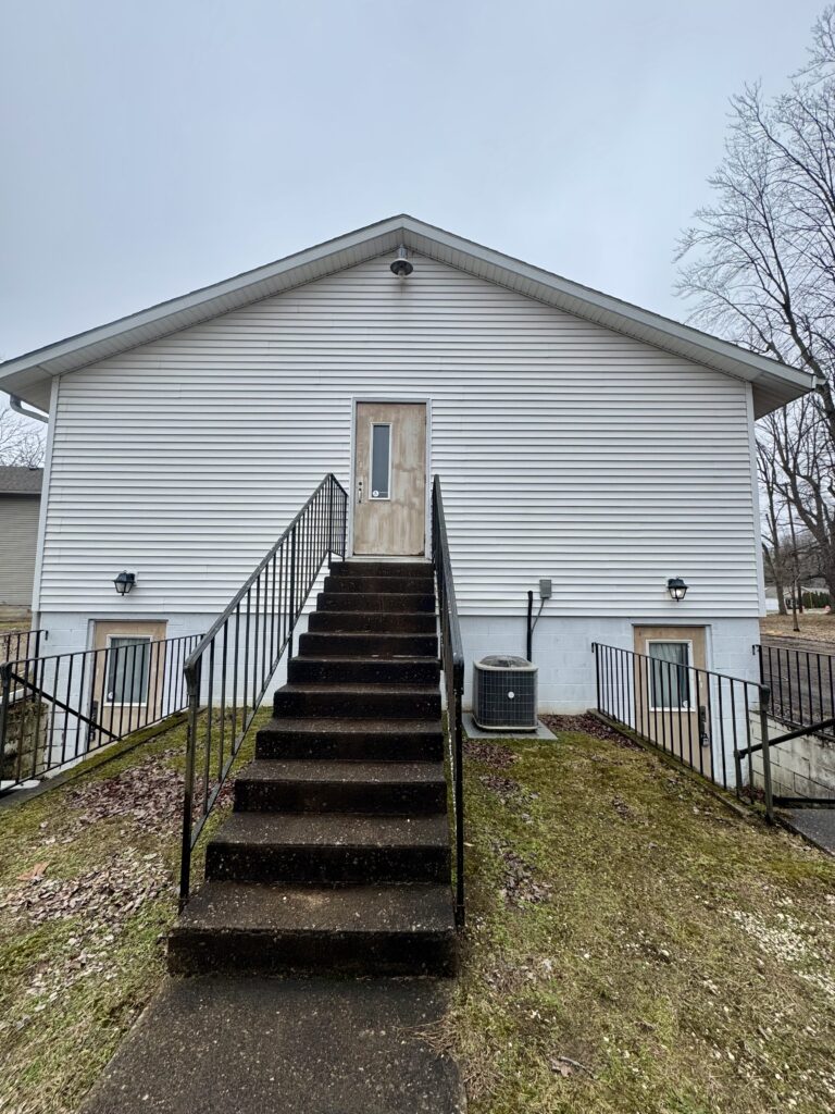 After Wiley's Pressure Washing Service cleaned this vinyl siding at a bridal shop in Geneva OH