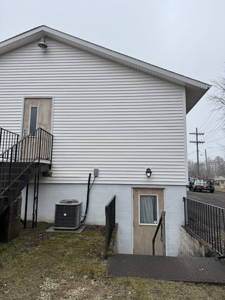 After Wiley's Pressure Washing Service cleaned this vinyl siding at a bridal shop in Geneva OH