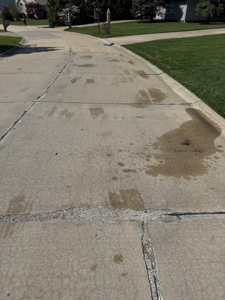 Concrete Cleaning Roadway before and after - by Wiley's pressure washing in Painesville, OH