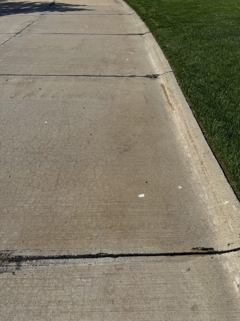 Concrete Cleaning Roadway before and after - by Wiley's pressure washing in Painesville, OH