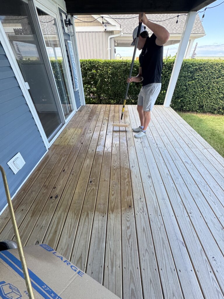 Person tapping a small wooden block with a mallet near sliding doors. The windows and entire house was also cleaned by Wiley's Pressure Washing In Madison, OH